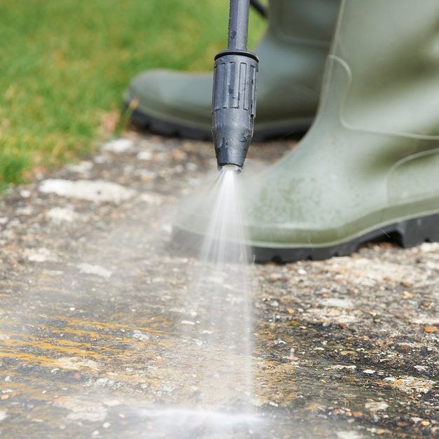 A gardener in Warrington providing a jet-washing service