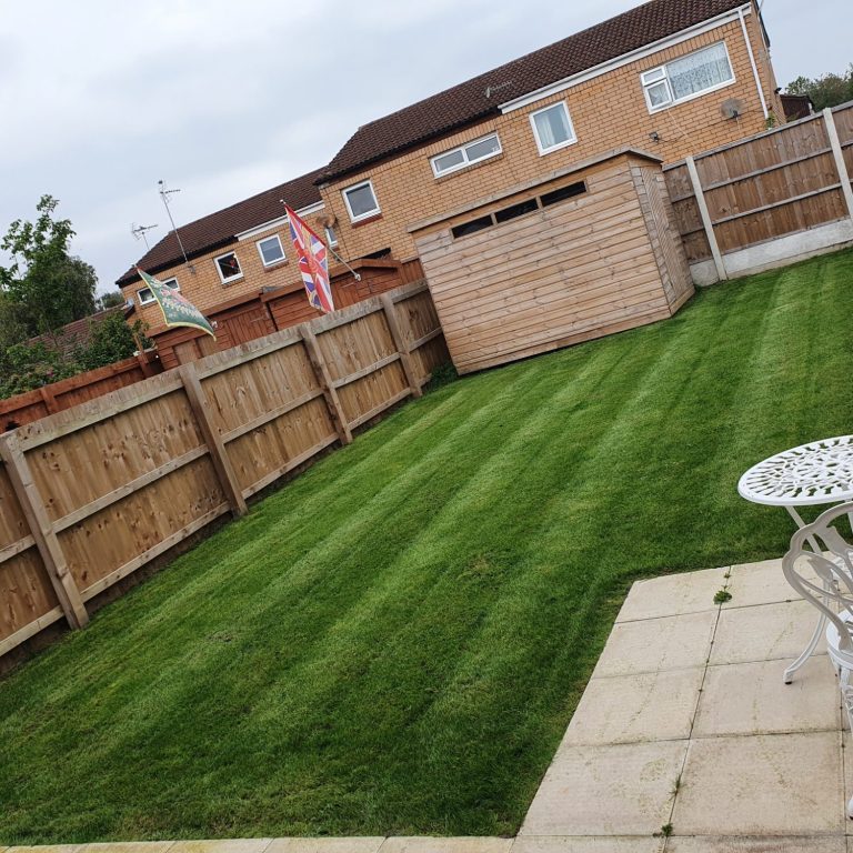 Healthy-looking grass after a visit from gardeners in cheshire